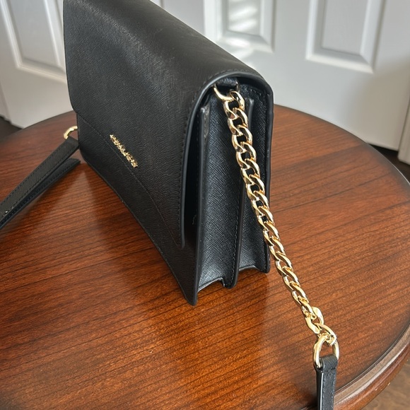 Michael Kors black purse with adjustabletable strap and gold chain. - Picture 3 of 9